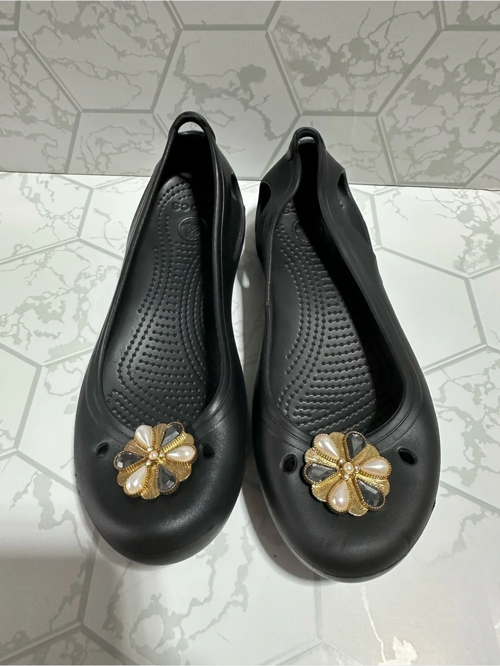 CROCS Black Women's Slip-On Flats with Gold Floral Charms
